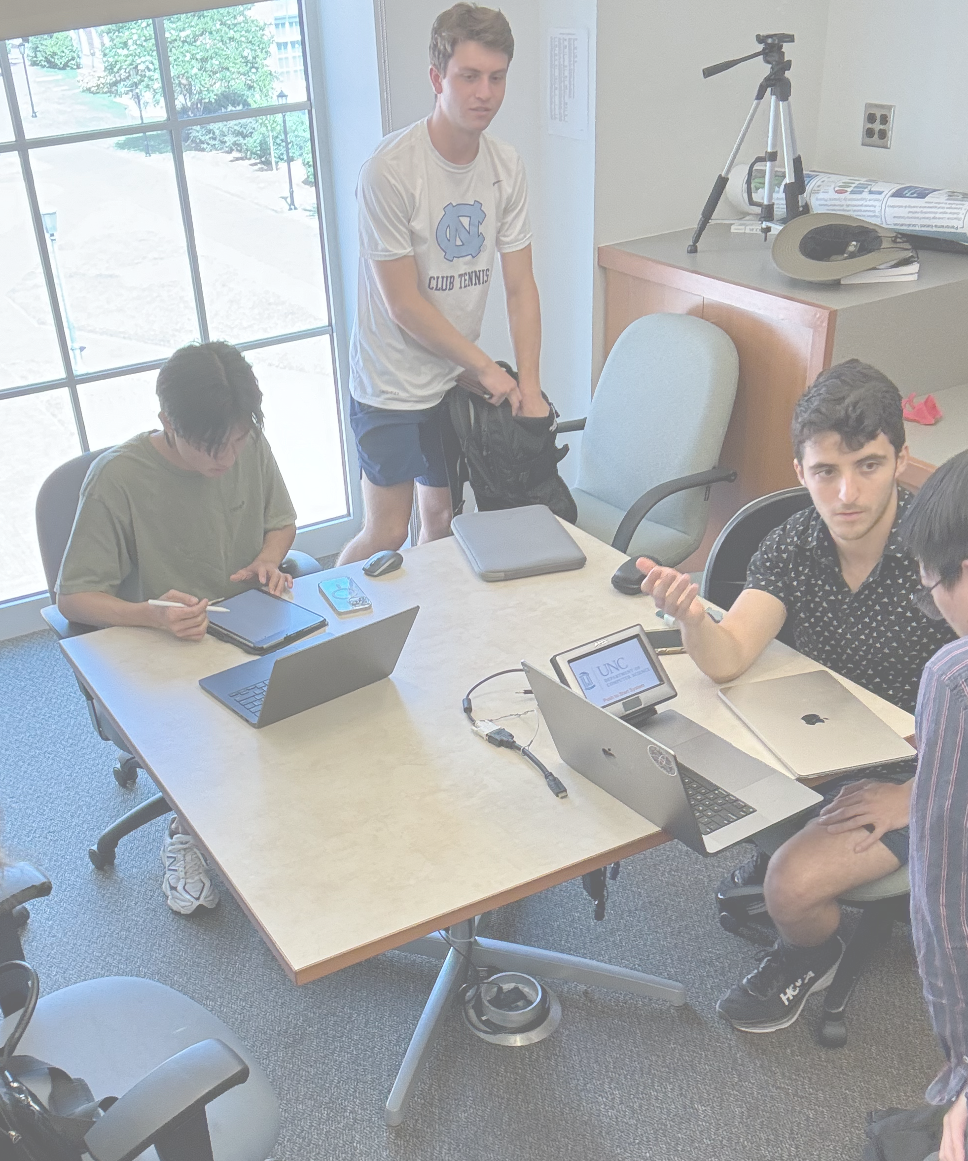 Some AI@UNC members working on a project